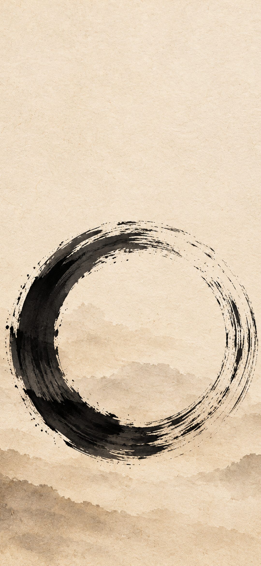 Black ink enso circle on warm washi paper above misty hills