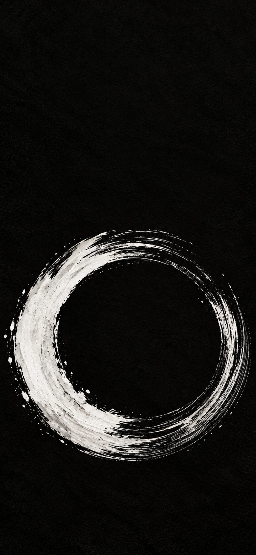 White brushstroke enso circle on black paper