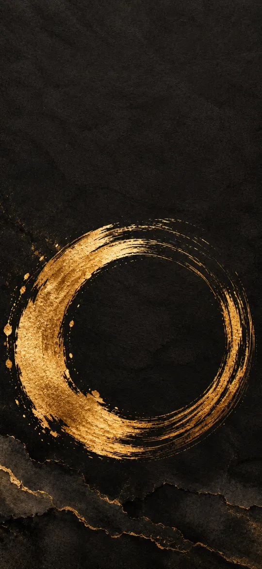 Gold brushstroke enso circle on textured charcoal paper