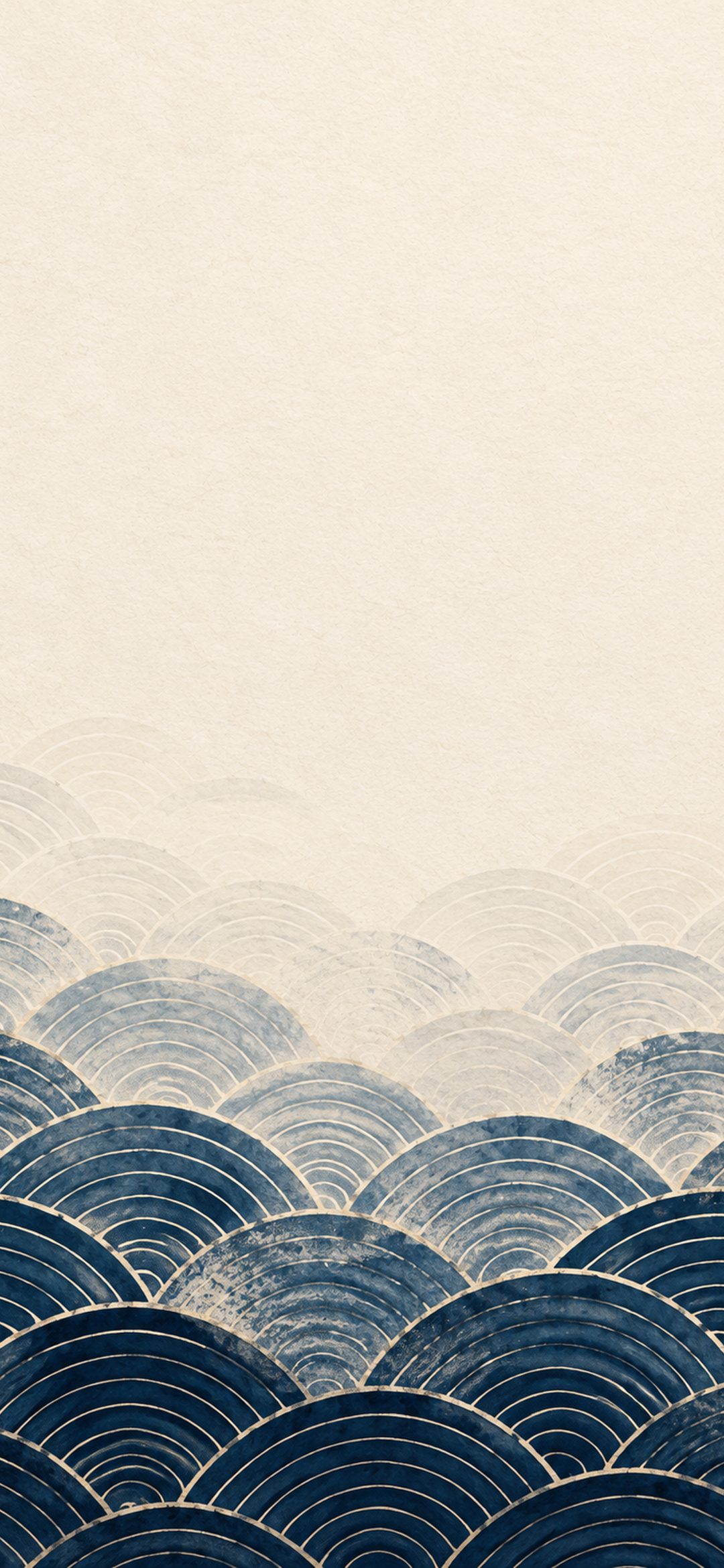 Deep indigo Japanese seigaiha wave pattern fading into textured cream paper