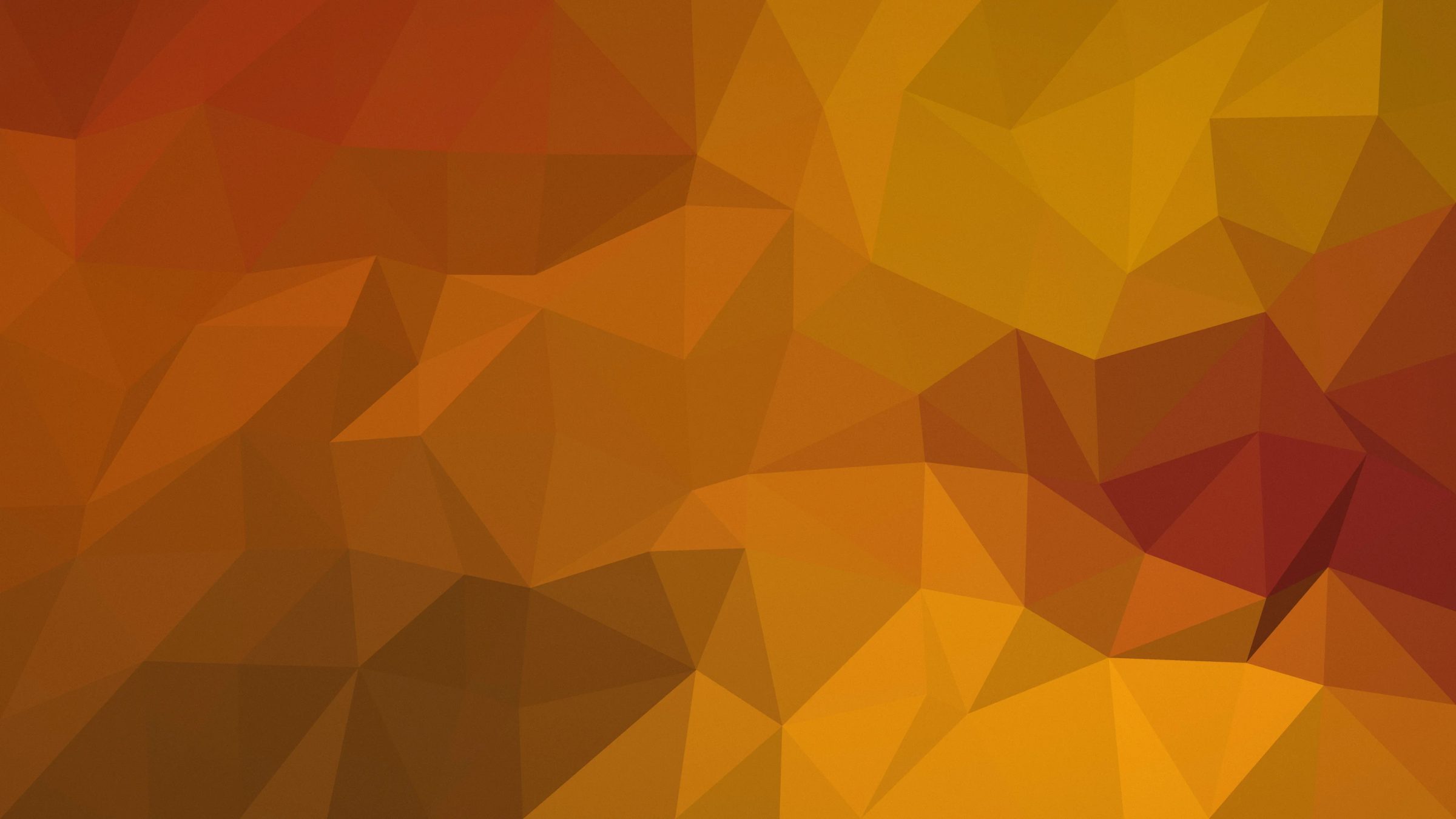 Autumn Facets: rust, amber and mustard facets shade across the screen like autumn leaves turned into geometry, PC wallpaper