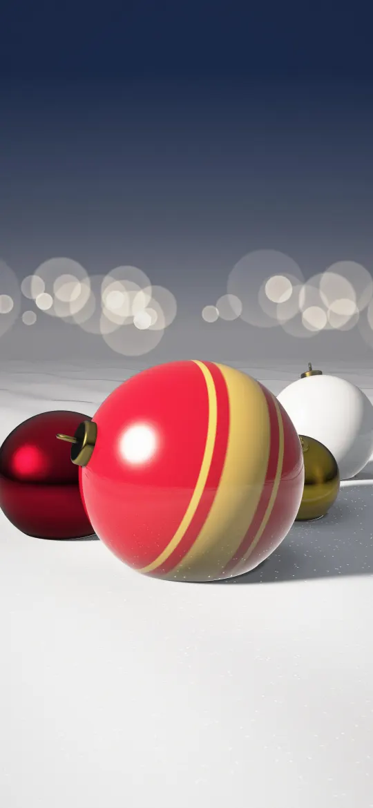 Baubles in Fresh Snow: a big red bauble with gold stripes rests in soft white snow beside deep red, white and gold baubles, under a navy sky with warm lights far behind, iPhone wallpaper