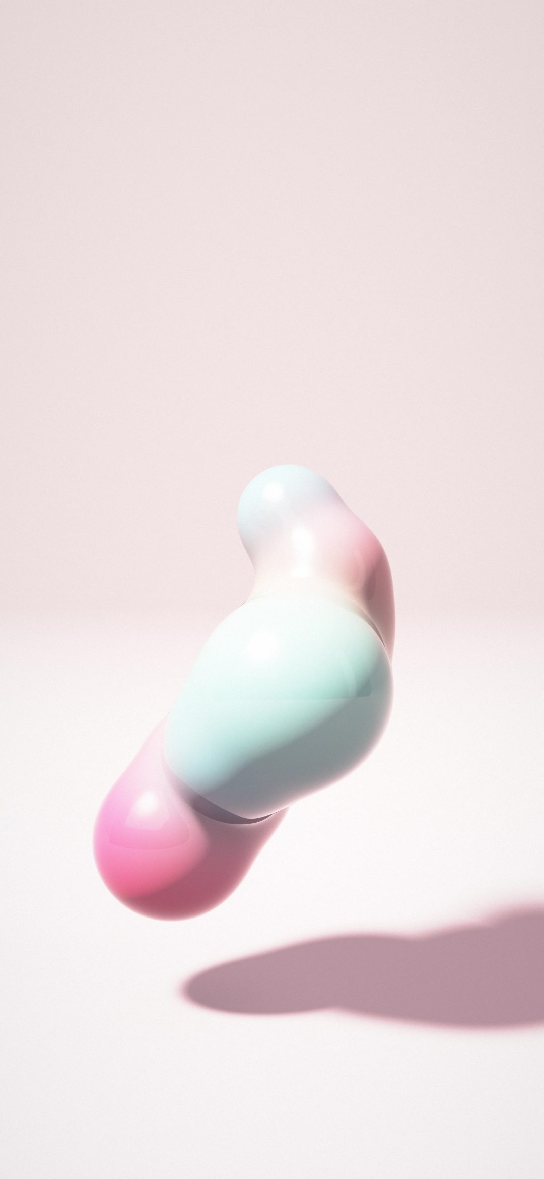 Bubblegum Blob Tower: a tall glossy blob of pink, sky blue, mint and lemon rises above a blush studio floor, its round lobes melting together, iPhone wallpaper