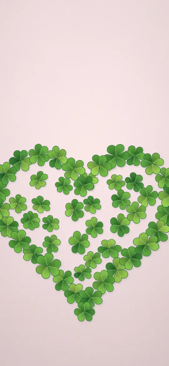 Clover Heart: dozens of small green clovers form a big heart shape on a soft blush background, iPhone wallpaper