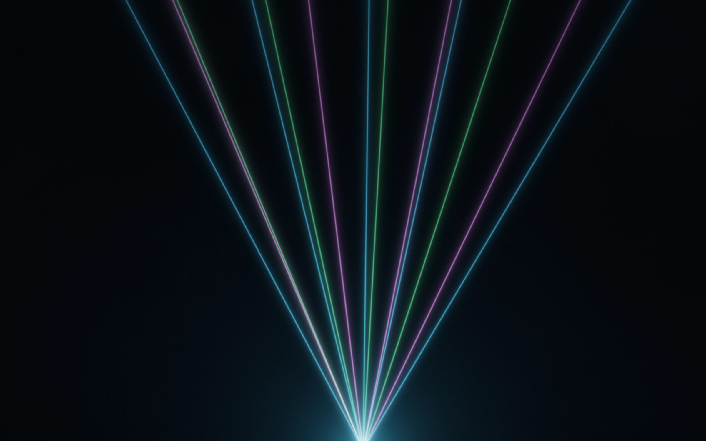Club Beam Spectrum: a wide fan of blue, green and pink laser beams spreads across hazy darkness from a single glowing source below, Mac wallpaper