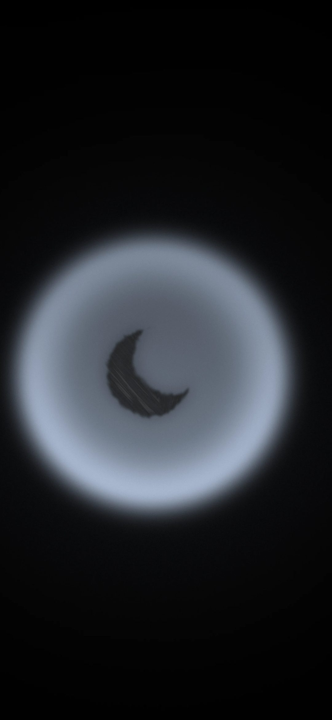 Crescent in an Ice Halo: a charcoal crescent moon sits inside a glowing ice-blue halo ring on black, iPhone wallpaper