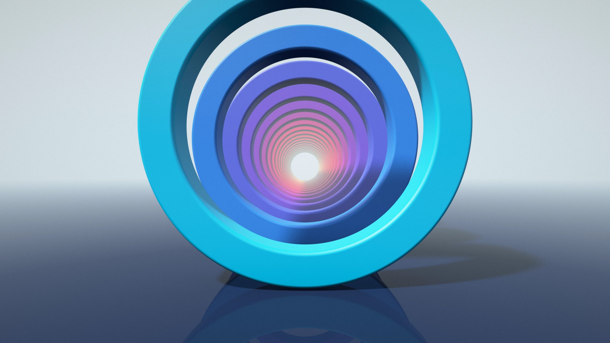 Electric Ring Tunnel: round hoops shift from cyan and blue to violet, pink and orange as they run into a white glow over a glossy navy floor, PC wallpaper