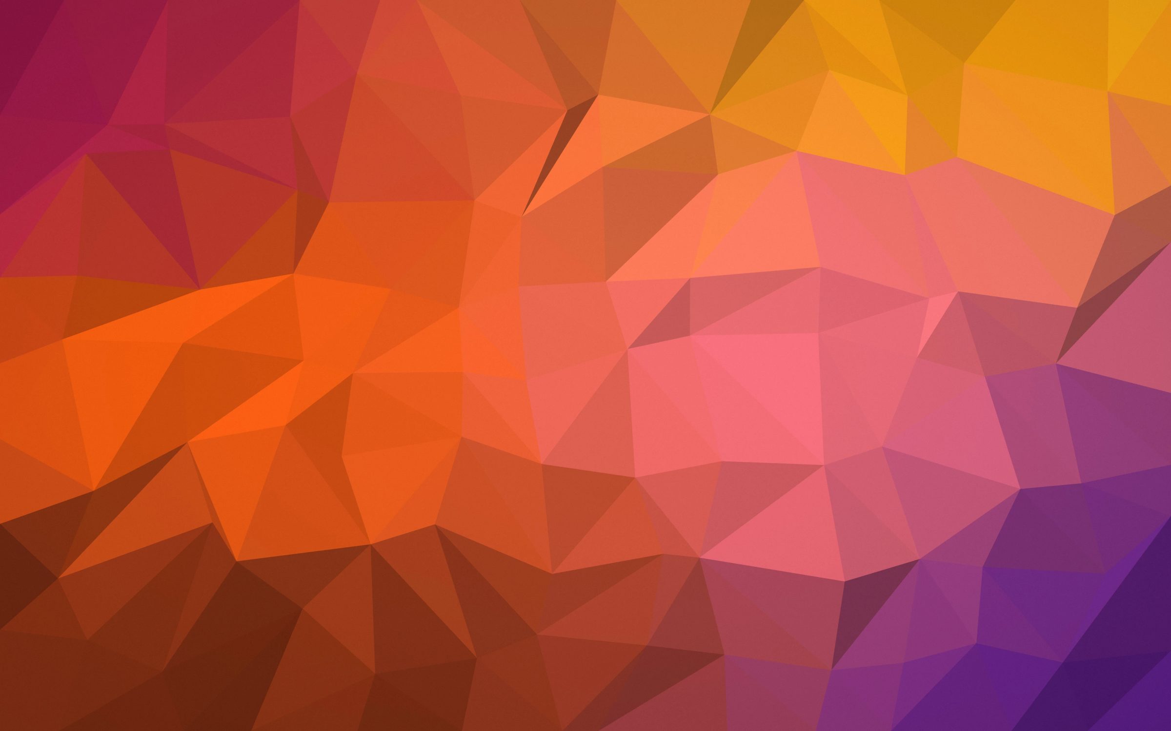 Ember Facets: geometric triangles shade from burnt orange and amber to plum, like a sunset broken into crystal facets, Mac wallpaper