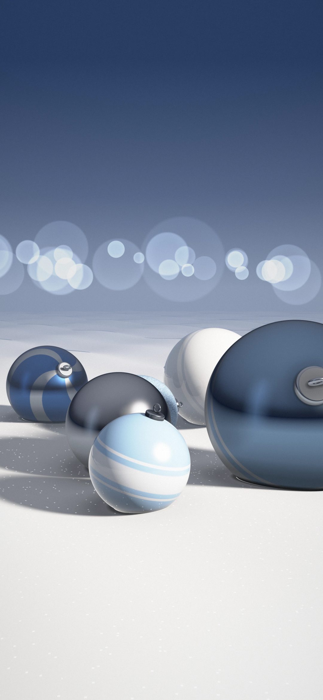 Icy Blue Snow Ornaments: pale blue, silver and white ornaments with silver caps lie scattered in sparkling snow, lit from the right under a cool blue winter sky, iPhone wallpaper