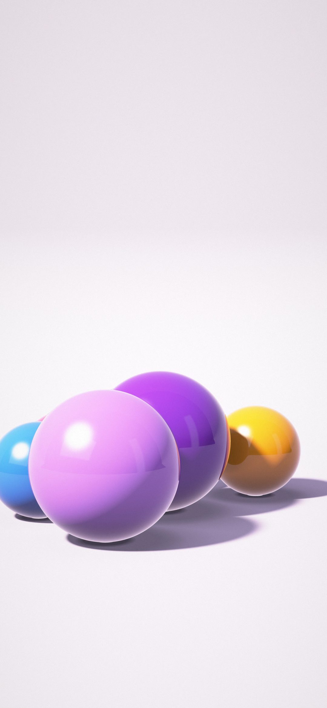 Lilac Bauble Cluster: purple, orange, blue and pink glossy balls and one chrome sphere rest on a lilac studio floor below a calm pale backdrop, iPhone wallpaper