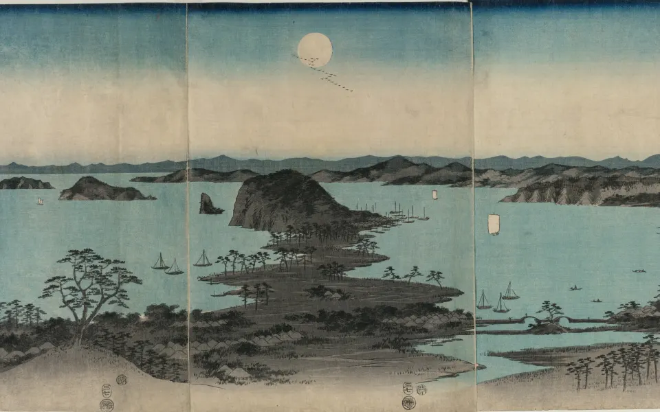 Full moon over a calm bay with small pine islands and boats