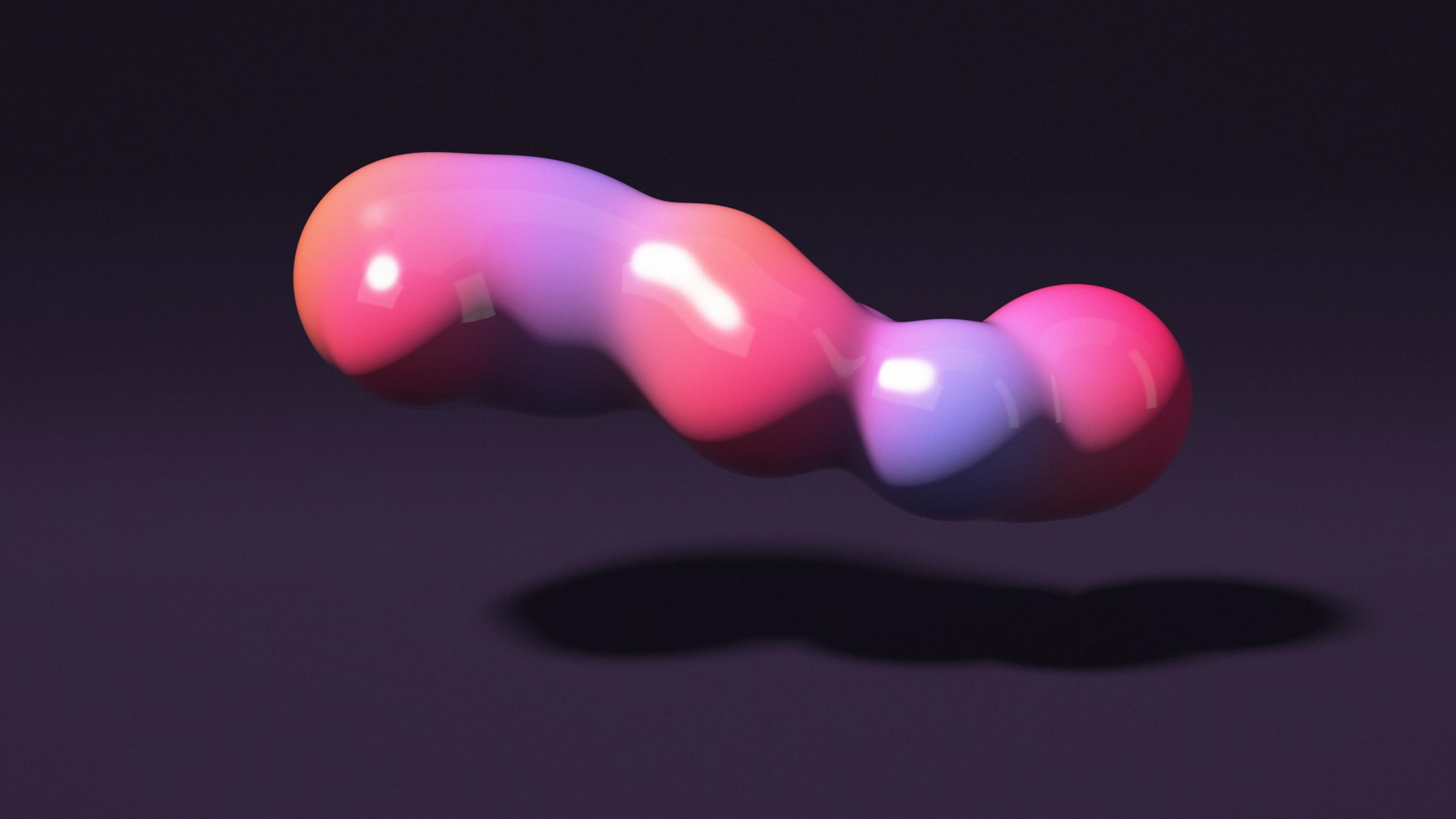 Neon Candy Melt: a glossy blob flows from orange to magenta, violet and electric blue as it floats above a dark plum floor in a studio glow, PC wallpaper