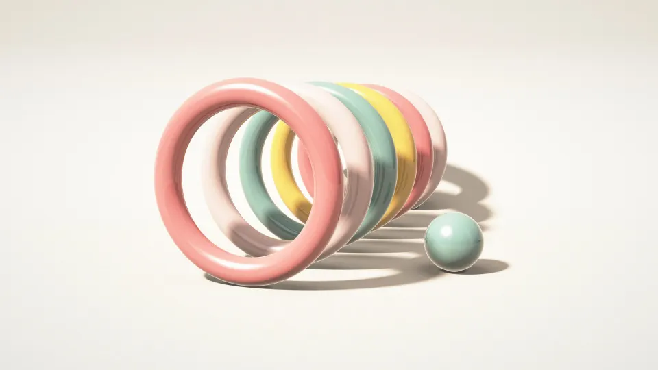 Pastel Hoop Parade: a row of standing hoops in coral, blush, sage and butter yellow recedes across a cream studio floor next to a small ball, PC wallpaper