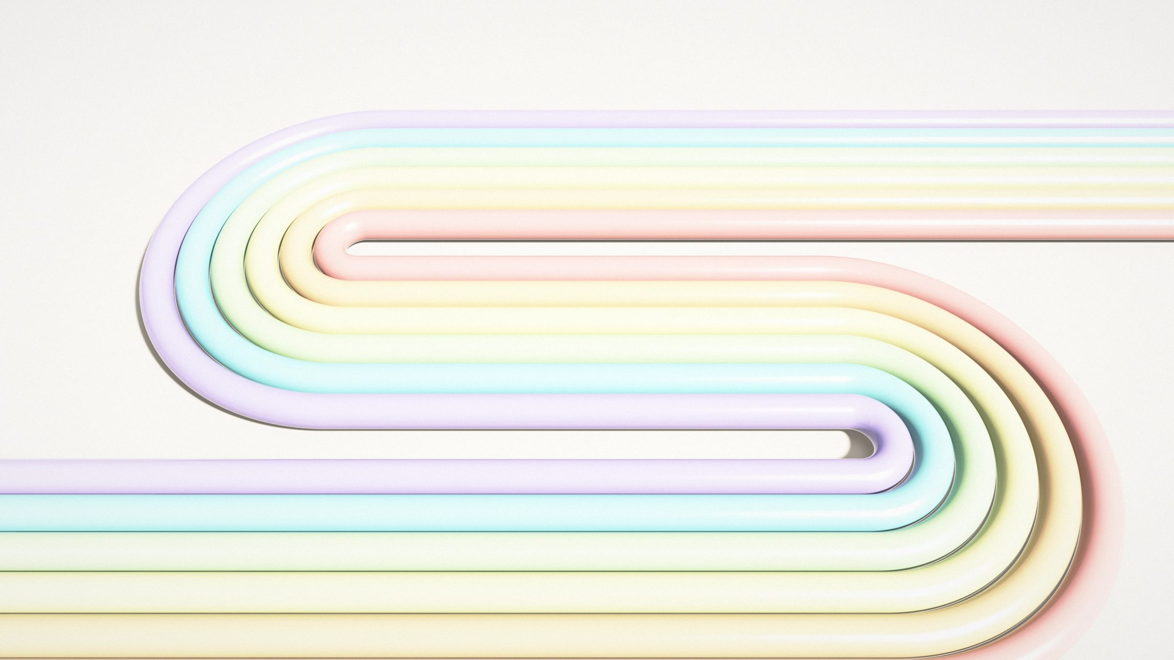 Pastel Tube Ribbon: six pastel tubes in pink, peach, lemon, mint, aqua and lilac fold into a ribbon that winds across a cream studio floor, PC wallpaper