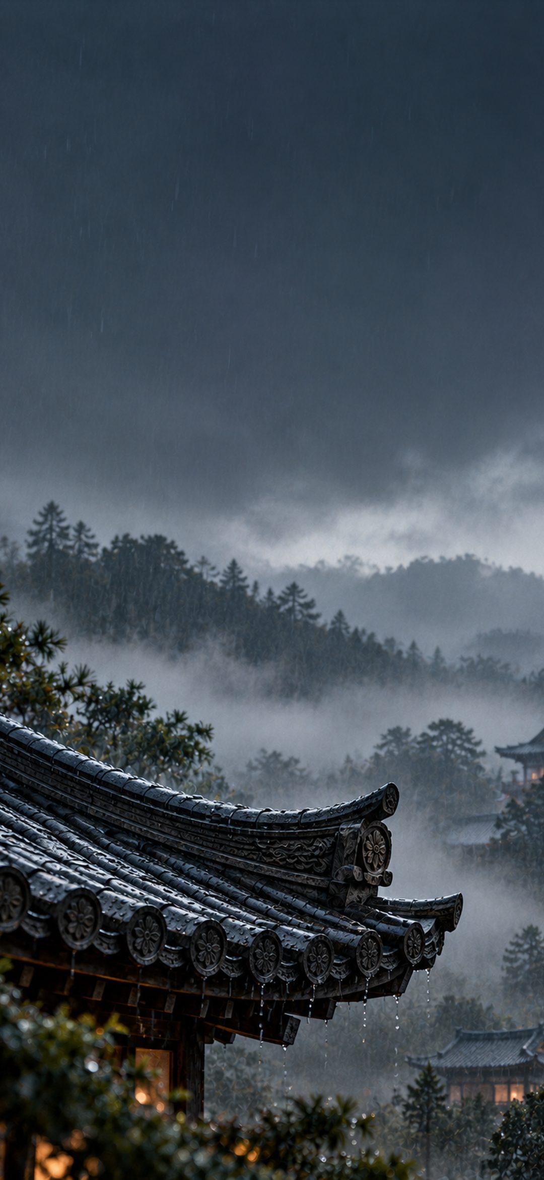 Curved dark tiled temple rooftop in the rain with misty mountains and a blue-grey sky