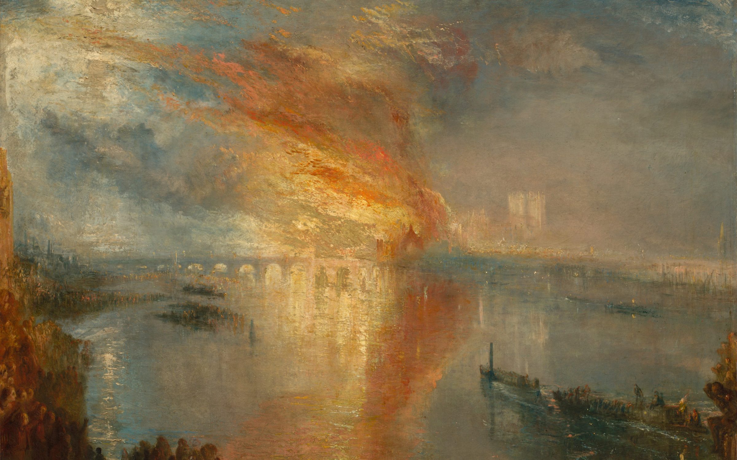 Orange fire and smoke over a river at dusk, reflected in the water