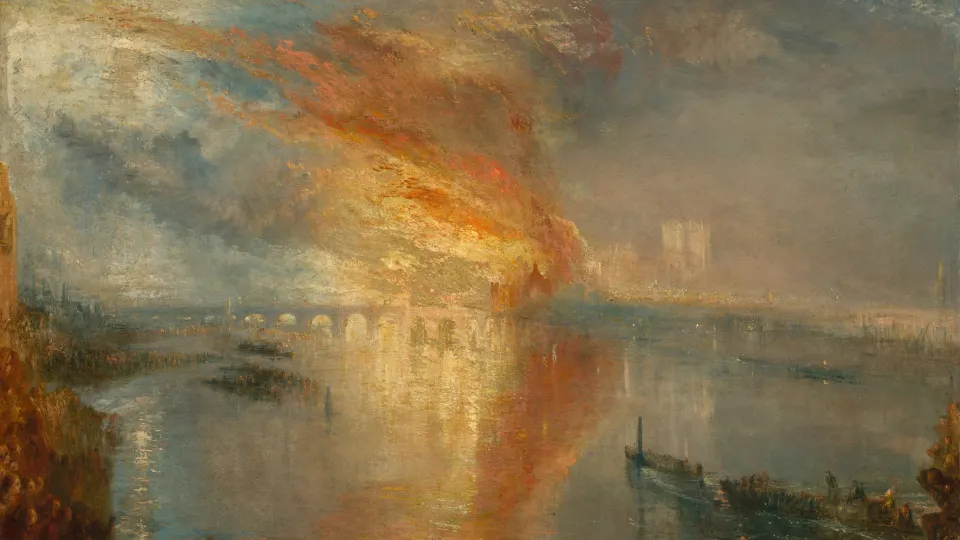 Orange fire and smoke over a river at dusk, reflected in the water