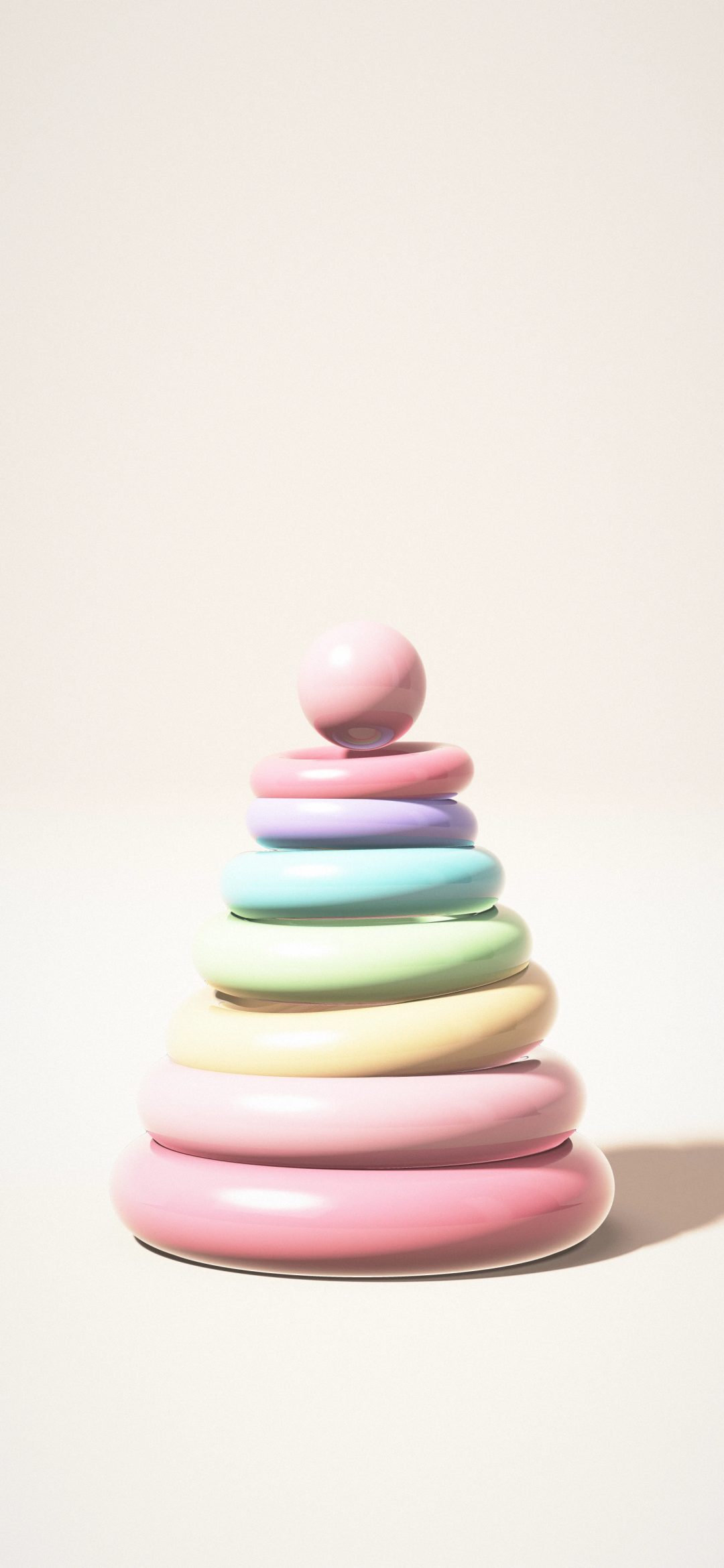 Sorbet Stacking Rings: seven sorbet coloured rings in pink, peach, mint, aqua and lilac stack into a soft tower on a pale peach studio floor, iPhone wallpaper