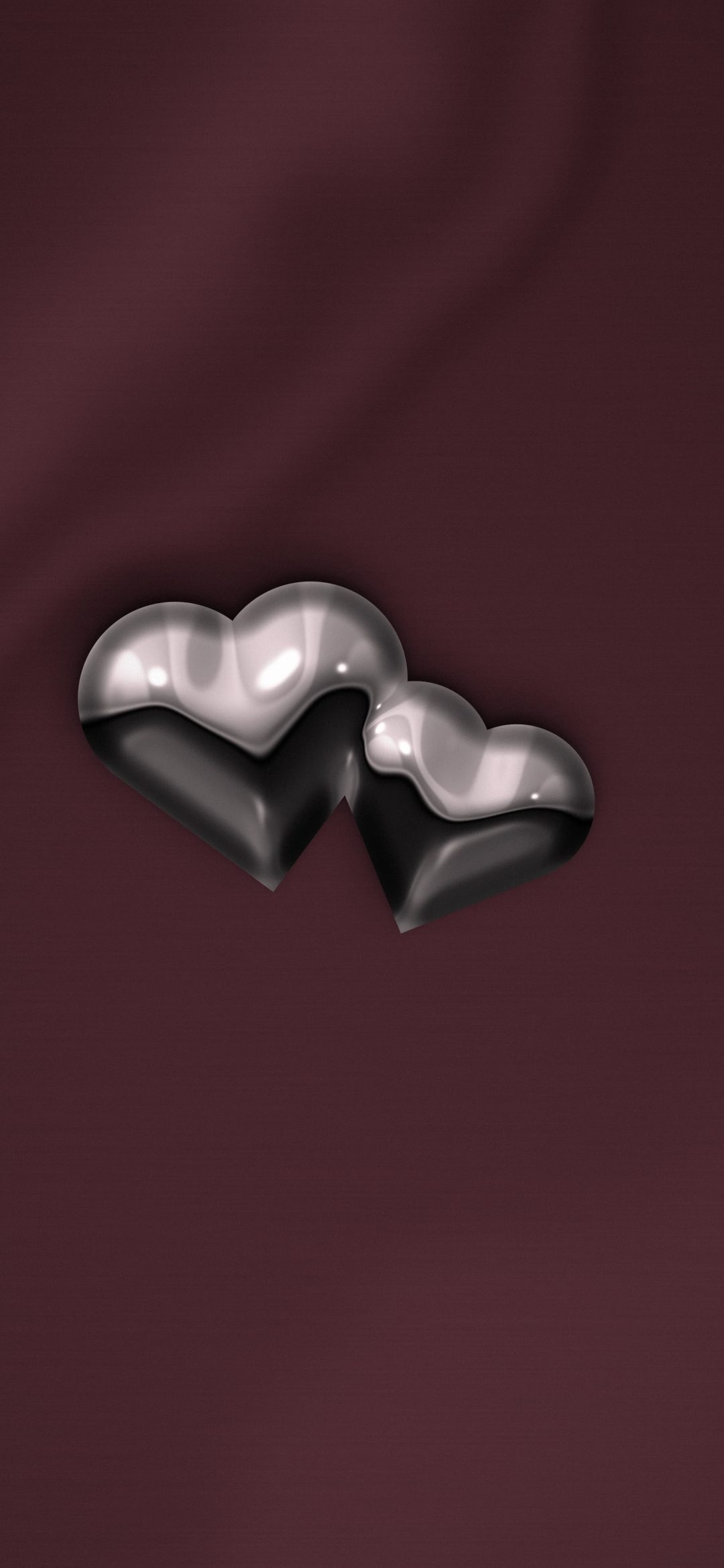 Twin Chrome Hearts: two overlapping polished chrome hearts float on draped wine-red satin, iPhone wallpaper