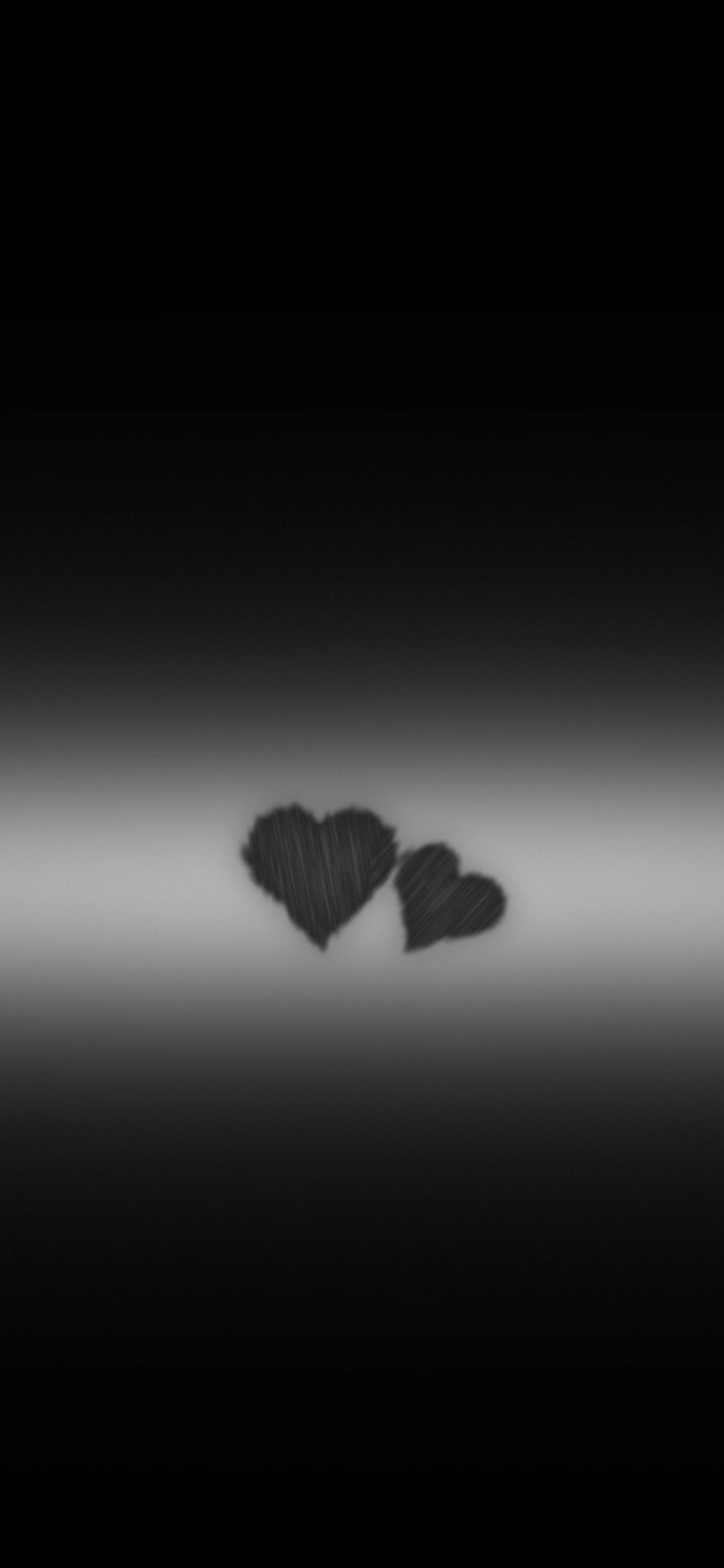 Two Hearts on a Light Band: two small charcoal hearts rest on a soft horizontal band of white light across a black screen, iPhone wallpaper
