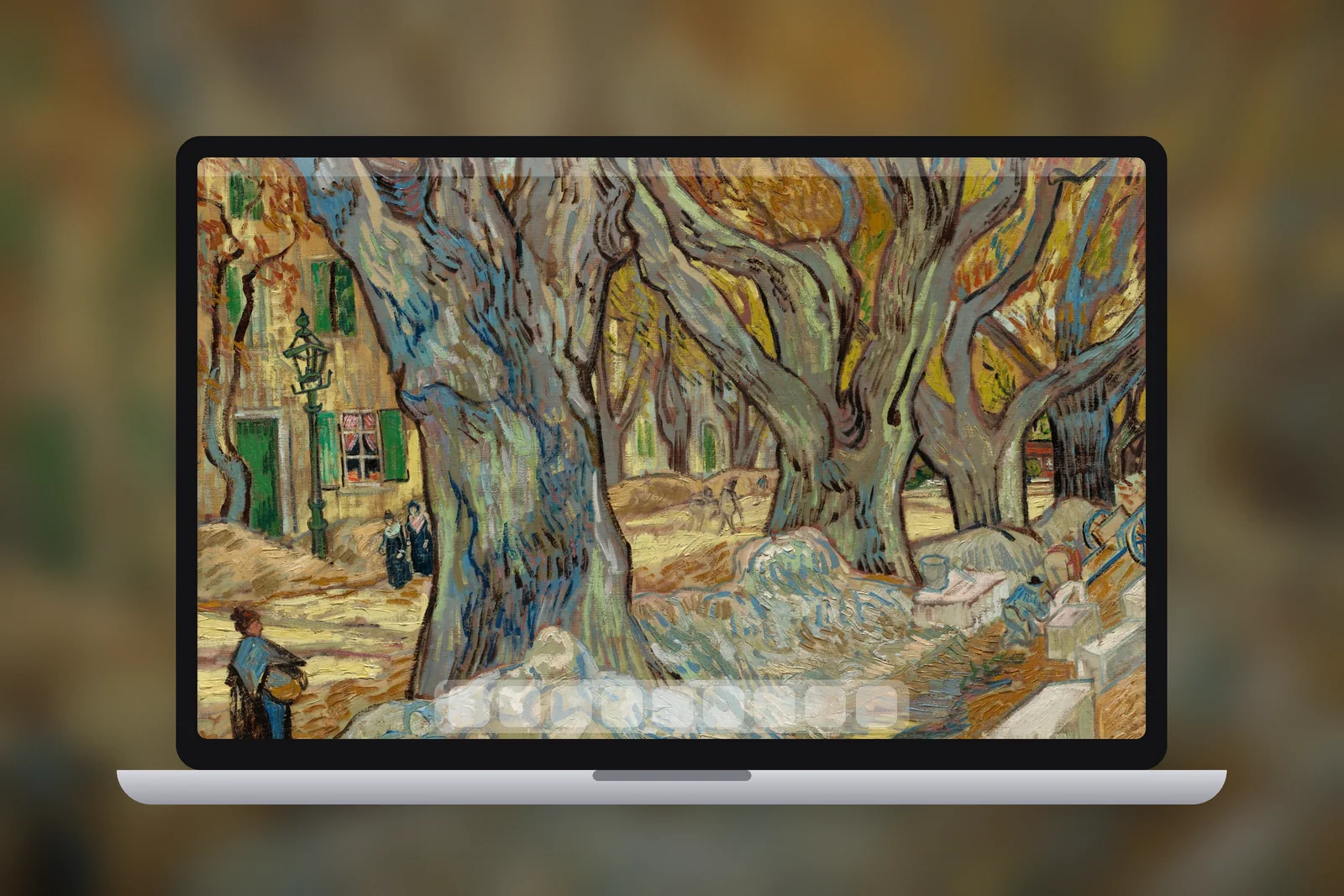 A Mac laptop showing the Golden Plane Tree Avenue wallpaper on its desktop